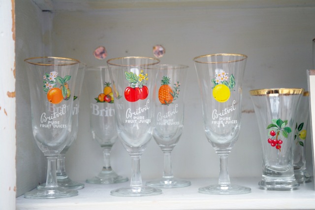 Vintage glassware at Boscombe Vintage Market, Bournemouth, Dorset. Colourful vintage Britvic glasses.